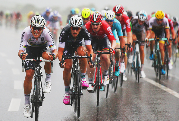 ZELANDE, NETHERLANDS - JULY 05:  Michal Kwiatkowski of Poland and Etixx-Quick Step (L) rides through the rain with the peloton during stage two of the 2015 Tour de France, a 166km stage between Utrecht and Zelande, on July 5, 2015 in Zelande, Netherlands.  (Photo by Bryn Lennon/Getty Images)