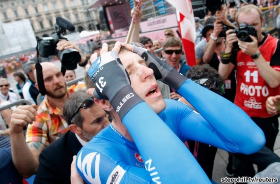 Garmin-Barracuda's Hesjedal of Canada celebrates after crossing the finish line in the 30km (18 miles) time trial in the 21st and last stage of the Giro d'Italia cycling race in Milan