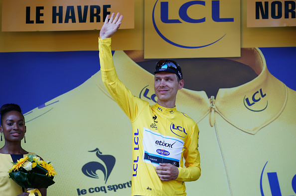 LE HAVRE, FRANCE - JULY 09:  Tony Martin of Germany and Etixx-Quick Step celebrates as he is awarded the yellow jersey on the podium after stage six of the 2015 Tour de France, a 191.5km stage between Abbeville and Le Havre, on July 9, 2015 in Le Havre, France.  (Photo by Doug Pensinger/Getty Images)