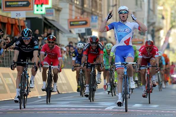French rider Arnaud Demare (R) celebrates as he crosses the finish line to win the 107th edition of the Milan - San Remo cycling race on March 19, 2016 in San Remo. Arnaud Demare won the 295 km race ahead British Ben Swift of Team Sky (L) and Belgian Jurgen Roelandts.  / AFP / MARCO BERTORELLO        (Photo credit should read MARCO BERTORELLO/AFP/Getty Images)